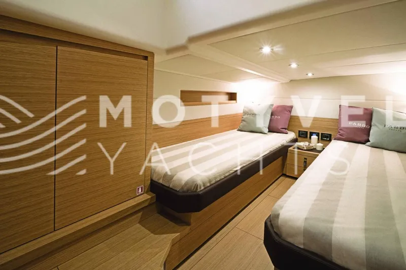  Yacht Photos Pics Luxurious 2023 Pardo Yachts 50 interior cabin with twin beds and elegant wood finish.