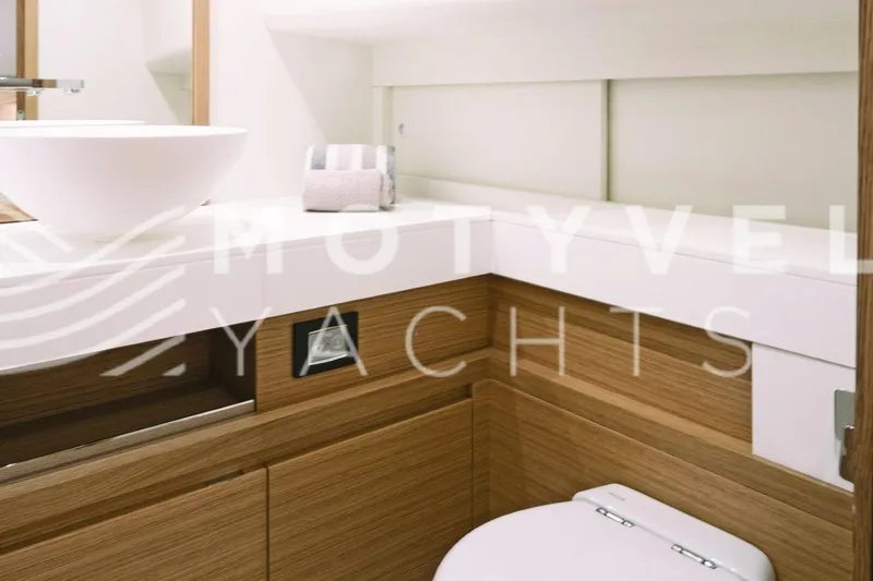  Yacht Photos Pics Modern bathroom interior of 2023 Pardo Yachts 50, featuring sleek wood and white design.