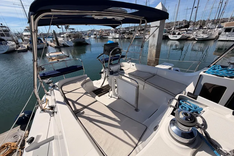 Wailele Yacht Photos Pics 2007 Hunter 44 Deck Salon yacht cockpit with marina view, featuring seating and helm station.
