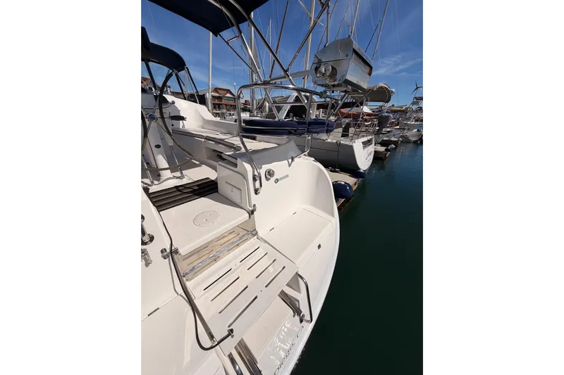 Wailele Yacht Photos Pics 2007 Hunter 44 Deck Salon sailboat docked, showcasing cockpit and marina view.