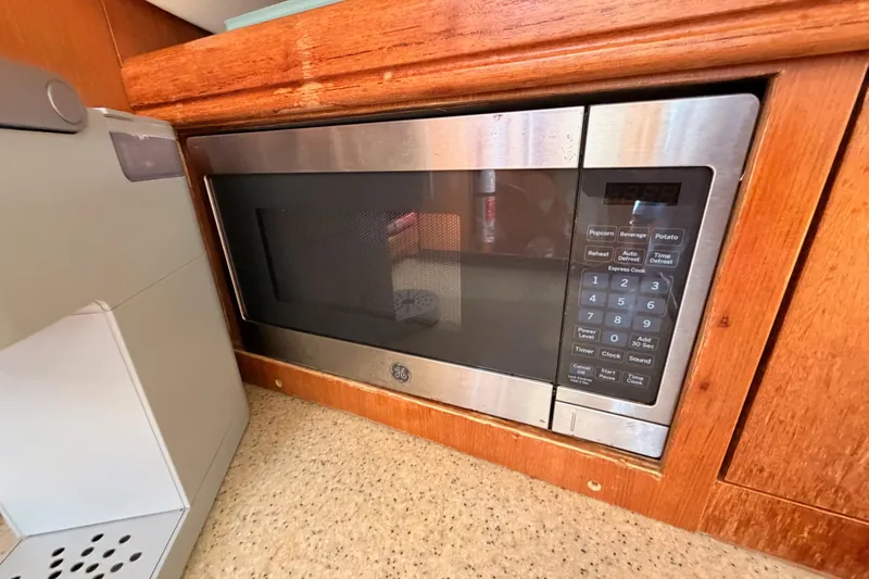Wailele Yacht Photos Pics Built-in GE microwave in 2007 Hunter 44 Deck Salon yacht kitchen.