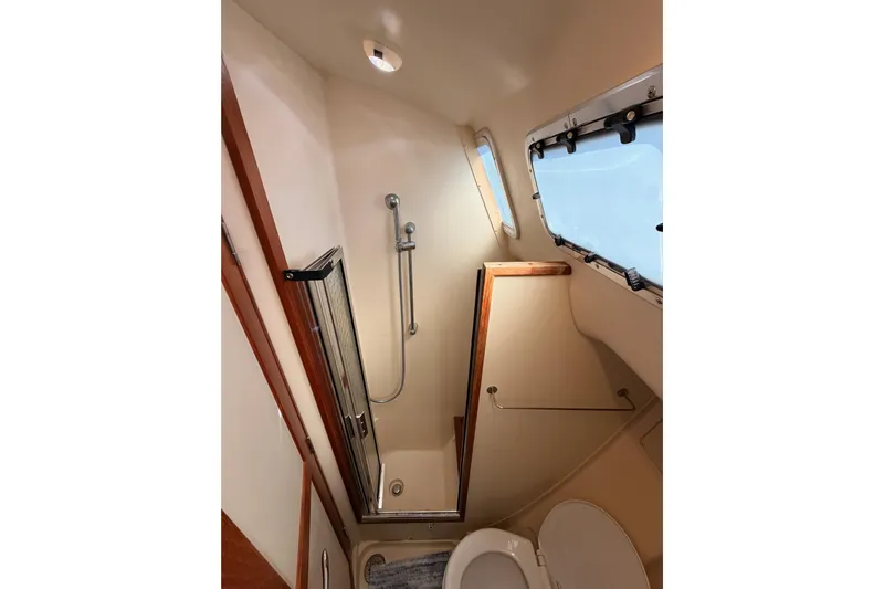 Wailele Yacht Photos Pics Bathroom interior of 2007 Hunter 44 Deck Salon yacht with shower and window.