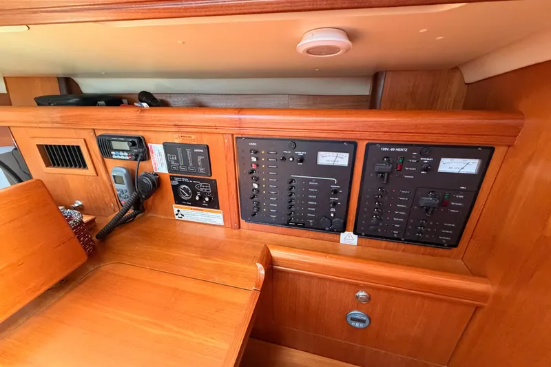 Wailele Yacht Photos Pics Control panel of a 2007 Hunter 44 Deck Salon yacht, featuring navigation and communication equipment.