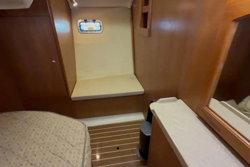 Wailele Yacht Photos Pics 2007 Hunter 44 Deck Salon interior with wood paneling and cozy seating area.