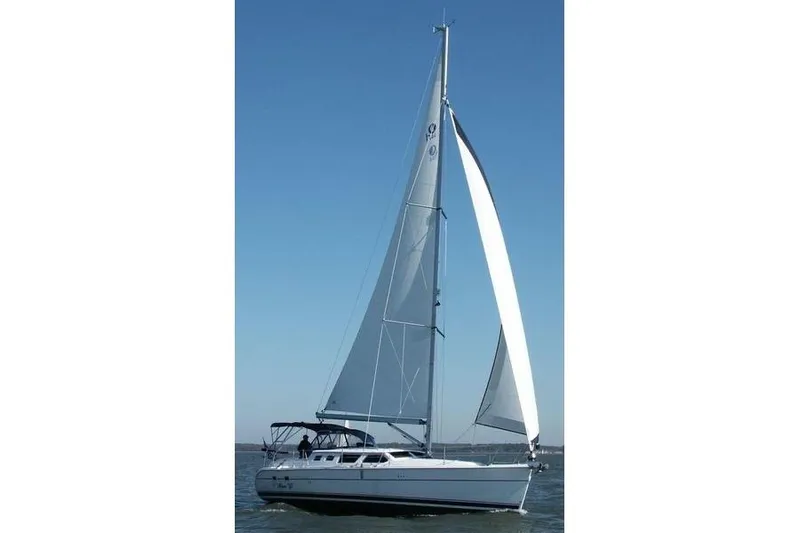 Wailele Yacht Photos Pics 2007 Hunter 44 Deck Salon sailboat on open water under clear blue sky.