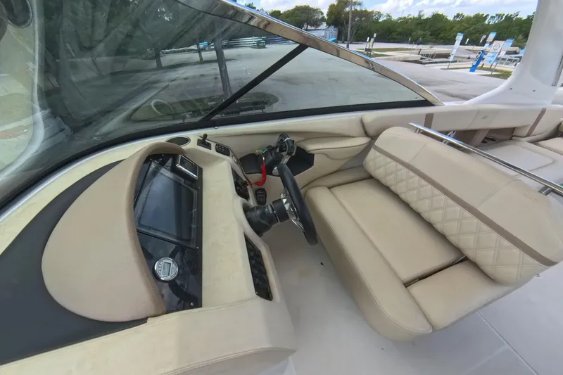  Yacht Photos Pics 2018 Regal 29 OBX boat interior with beige seating and modern dashboard.