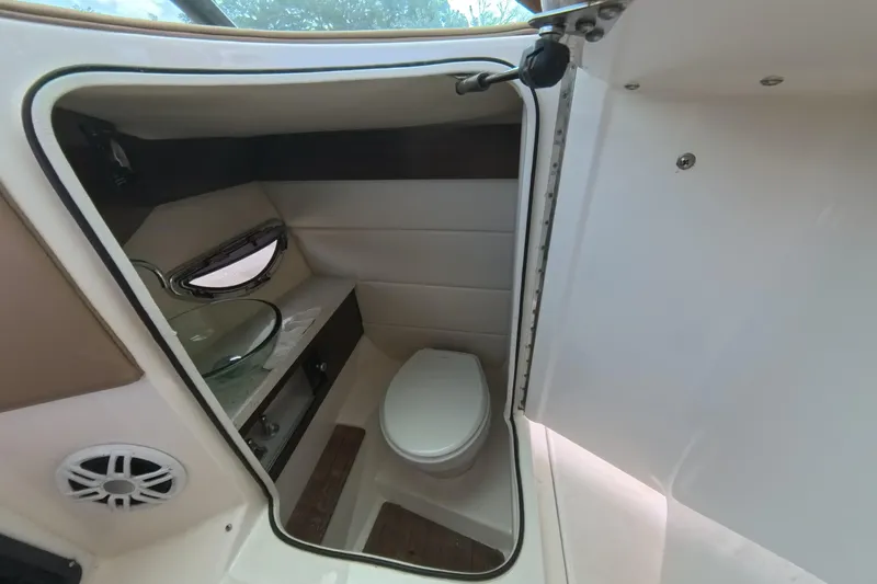  Yacht Photos Pics 2018 Regal 29 OBX boat interior bathroom with toilet and sink.