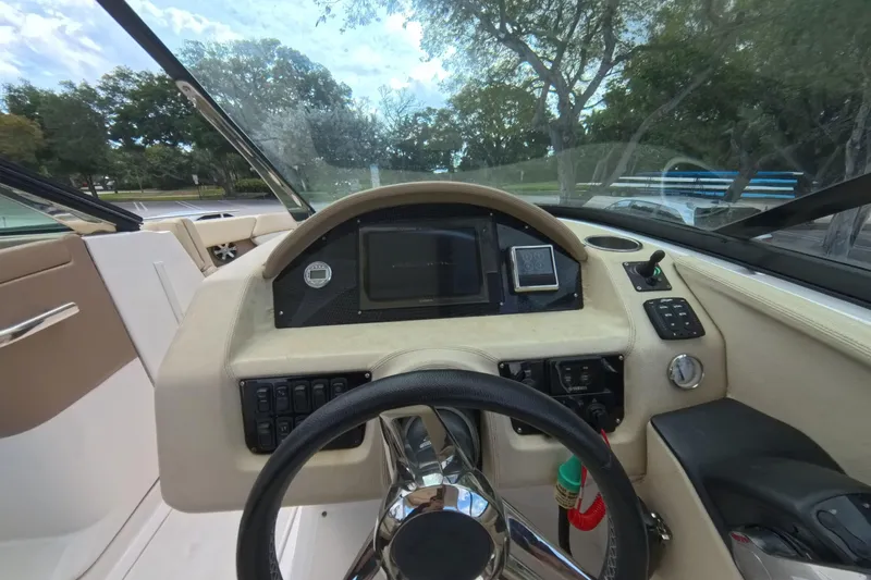  Yacht Photos Pics 2018 Regal 29 OBX boat dashboard with steering wheel and control panel.