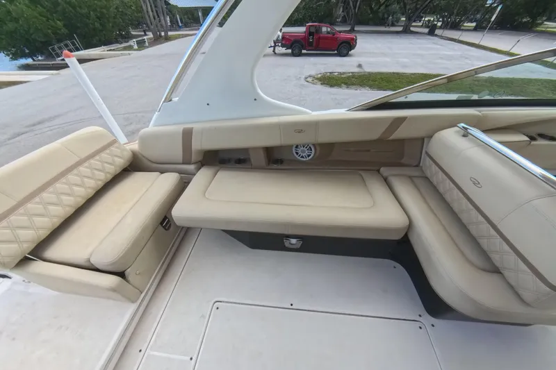  Yacht Photos Pics 2018 Regal 29 OBX boat interior with beige seating and sleek design.