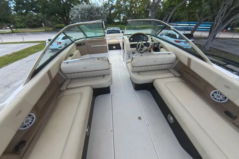  Yacht Photos Pics 2018 Regal 29 OBX boat interior with beige seating and modern dashboard.