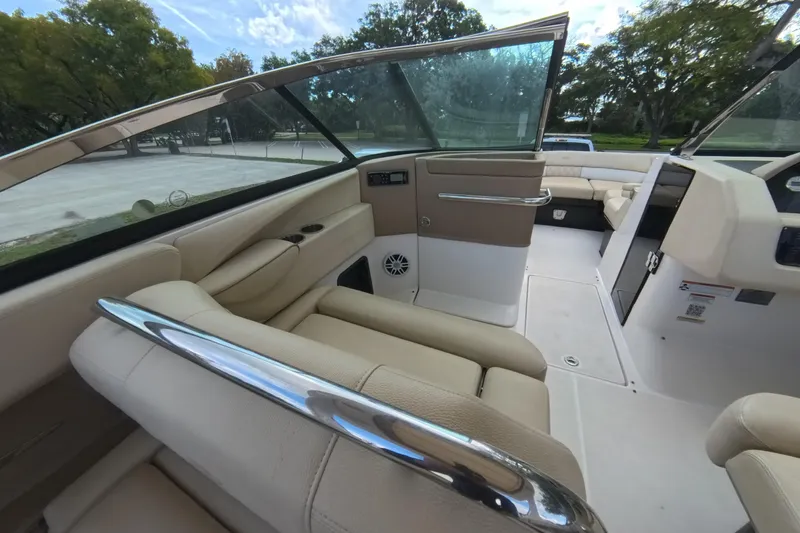  Yacht Photos Pics 2018 Regal 29 OBX boat interior with beige seating and sleek design.