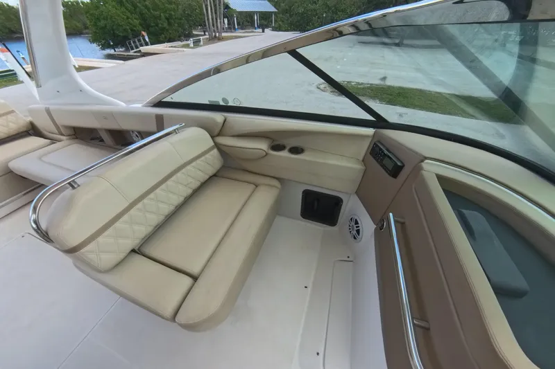  Yacht Photos Pics 2018 Regal 29 OBX boat interior with beige seating and modern dashboard.