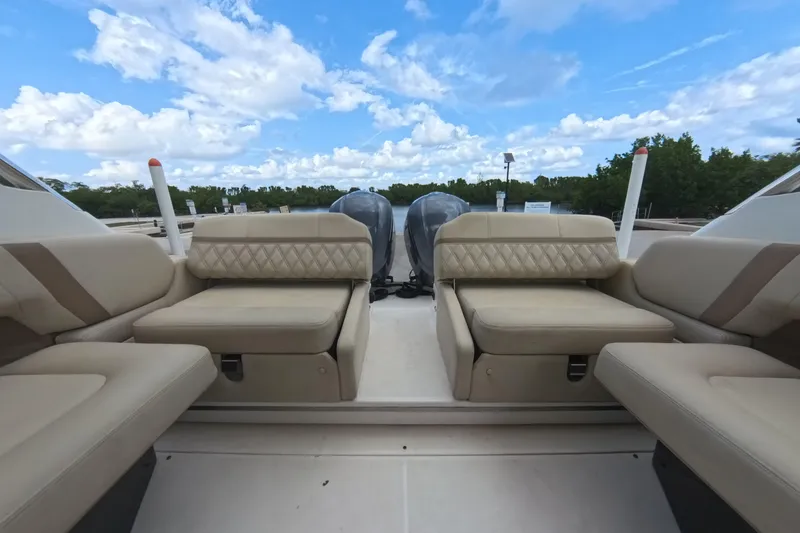  Yacht Photos Pics 2018 Regal 29 OBX boat interior with beige seating and twin outboard motors.