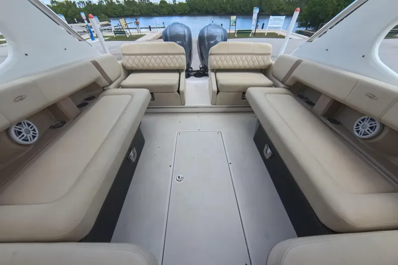  Yacht Photos Pics 2018 Regal 29 OBX boat interior with beige seating and twin outboard motors.