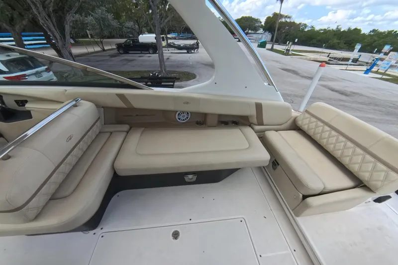  Yacht Photos Pics 2018 Regal 29 OBX boat interior with beige seating and sleek design.