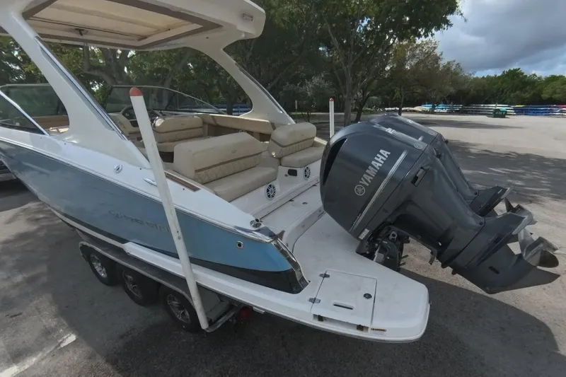  Yacht Photos Pics 2018 Regal 29 OBX boat with Yamaha outboard motor, parked on a trailer.