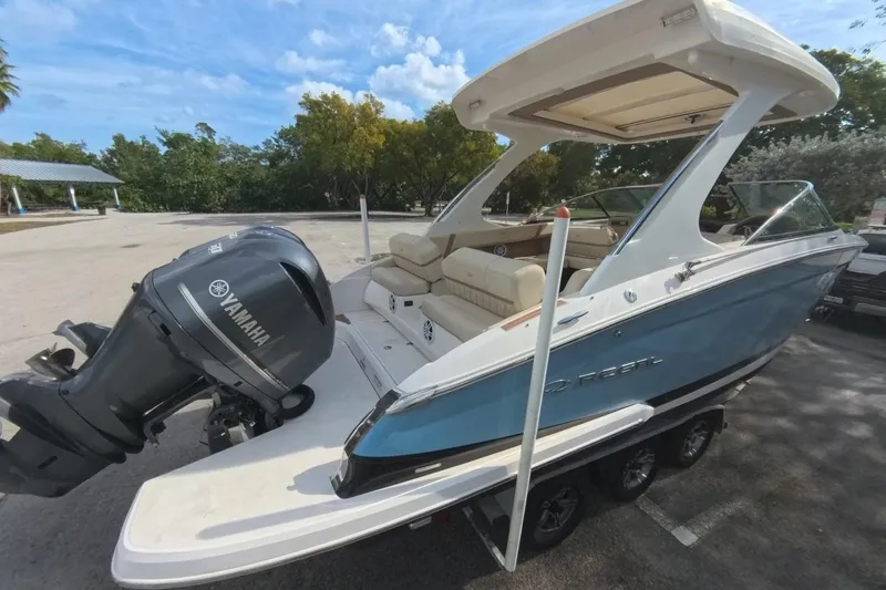  Yacht Photos Pics 2018 Regal 29 OBX boat with Yamaha outboard motor, parked on a trailer.