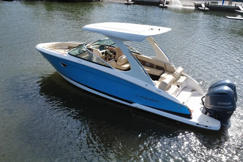  Yacht Photos Pics 2018 Regal 29 OBX boat with blue hull and Yamaha outboard engines on water.
