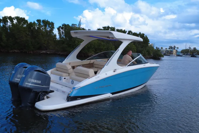  Yacht Photos Pics 2018 Regal 29 OBX boat with Yamaha engines cruising on a scenic waterway.