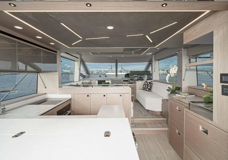  Yacht Photos Pics Luxurious interior of 2024 Sunseeker Manhattan 55 yacht with modern design and panoramic windows.