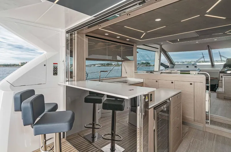  Yacht Photos Pics Luxurious interior of 2024 Sunseeker Manhattan 55 yacht with modern seating and sleek design.