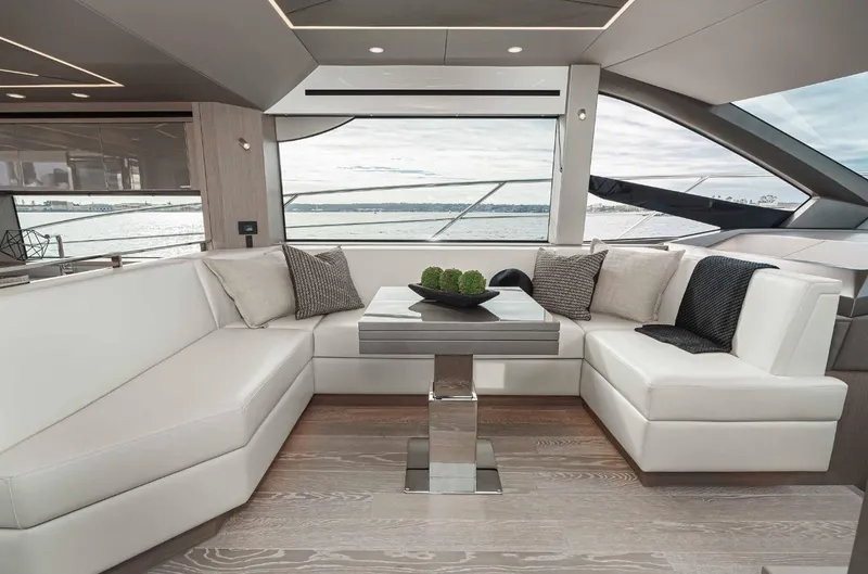  Yacht Photos Pics Luxurious interior of 2024 Sunseeker Manhattan 55 yacht with elegant seating and modern decor.