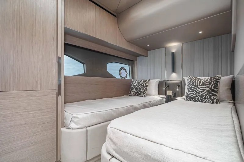  Yacht Photos Pics 2024 Sunseeker Manhattan 55 interior with twin beds and modern decor.