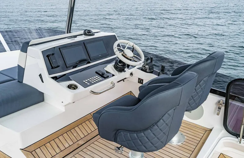  Yacht Photos Pics 2024 Sunseeker Manhattan 55 yacht helm with dual seats and modern controls.