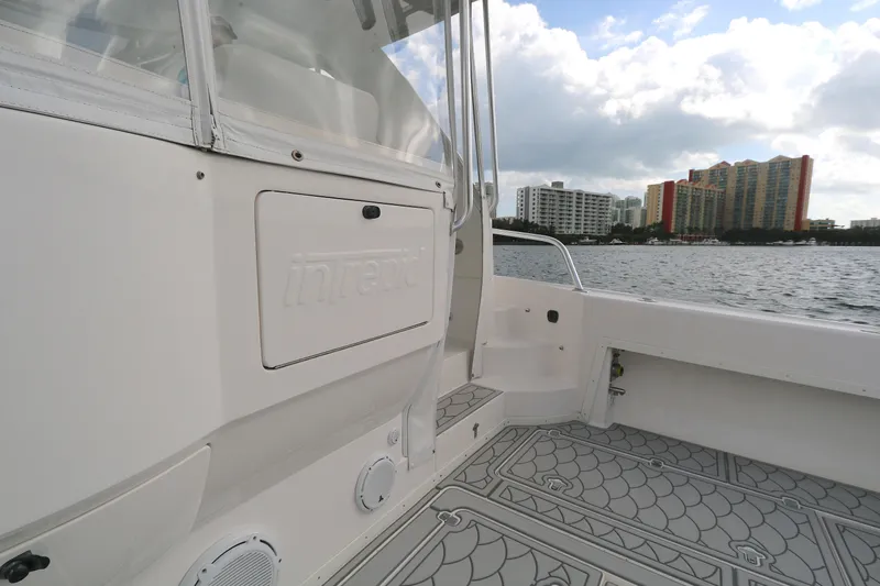  Yacht Photos Pics 2012 Intrepid 475 Sport Yacht deck with city skyline in background.