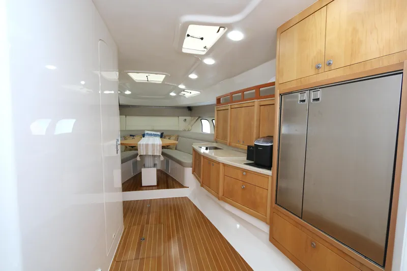  Yacht Photos Pics Interior of 2012 Intrepid 475 Sport Yacht with wood flooring and modern cabinetry.