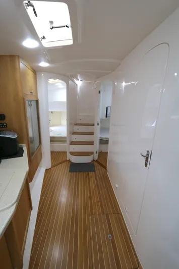  Yacht Photos Pics 2012 Intrepid 475 Sport Yacht interior with wooden flooring and modern design.