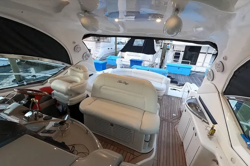  Yacht Photos Pics Interior of 2006 Sea Ray 44 Sundancer yacht with luxurious seating and helm station.