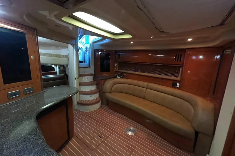  Yacht Photos Pics Luxurious interior of 2006 Sea Ray 44 Sundancer yacht with elegant seating and wood finishes.