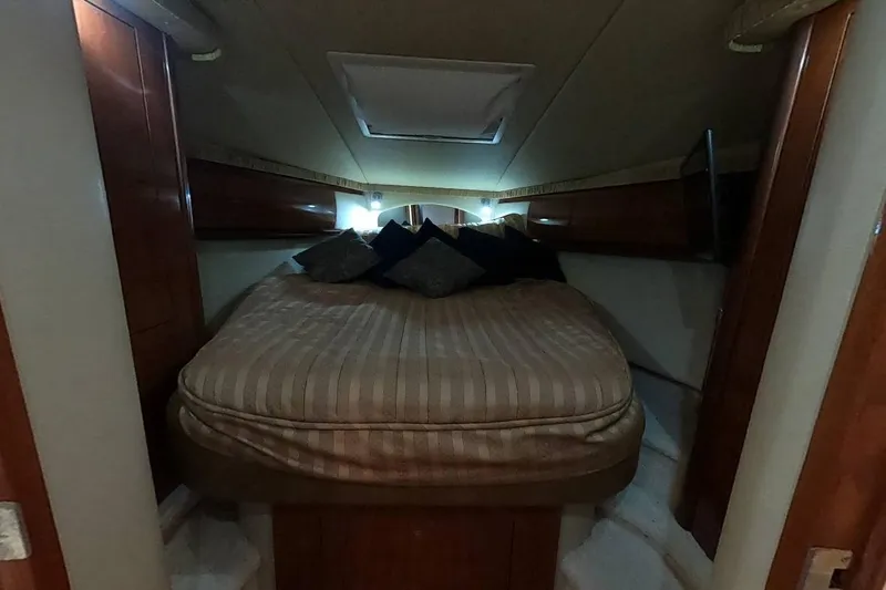  Yacht Photos Pics Luxurious cabin interior of 2006 Sea Ray 44 Sundancer yacht with cozy bed.