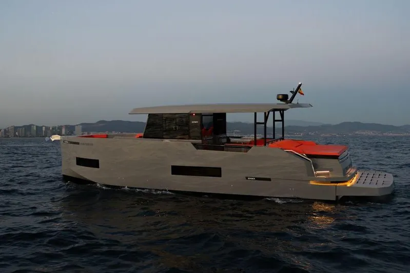  Yacht Photos Pics 2025 De Antonio Yachts D50 cruising on open water at sunset.