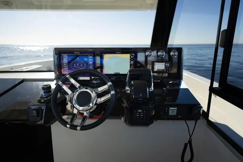  Yacht Photos Pics Cockpit of 2025 De Antonio Yachts D50 with advanced navigation displays and controls.