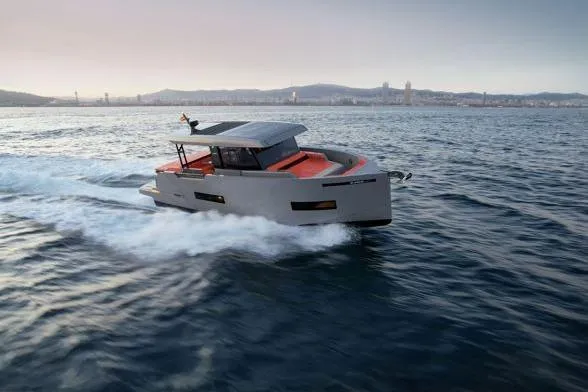  Yacht Photos Pics 2025 De Antonio Yachts D50 cruising on open water at sunset.