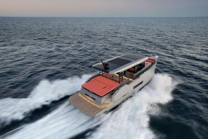  Yacht Photos Pics 2025 De Antonio Yachts D50 cruising on open sea at sunset.