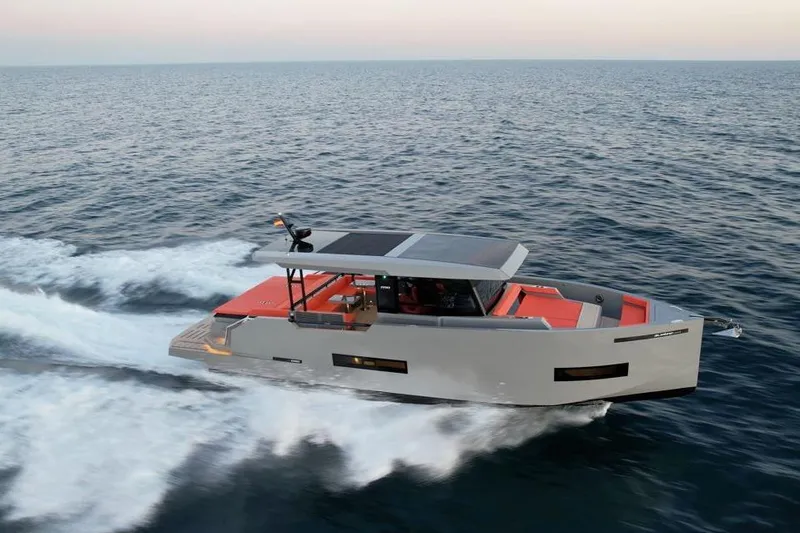  Yacht Photos Pics 2025 De Antonio Yachts D50 cruising on open sea at sunset.