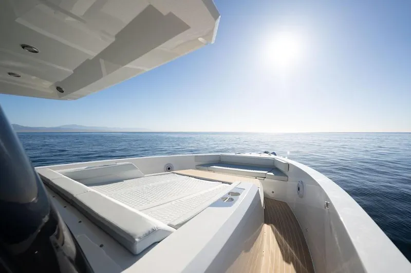  Yacht Photos Pics 2025 De Antonio Yachts D50 on open sea under clear blue sky.