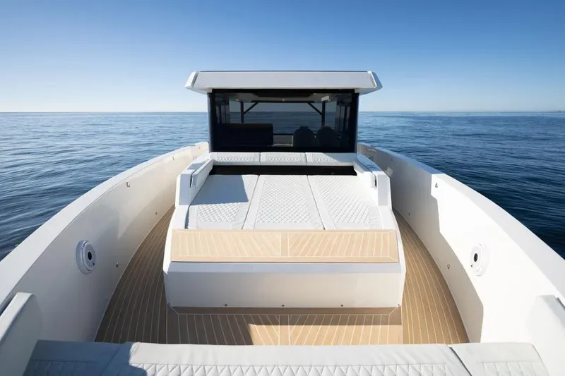  Yacht Photos Pics 2025 De Antonio Yachts D50 on calm sea, showcasing sleek deck design.