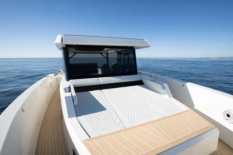  Yacht Photos Pics 2025 De Antonio Yachts D50 on calm sea, showcasing sleek deck design.