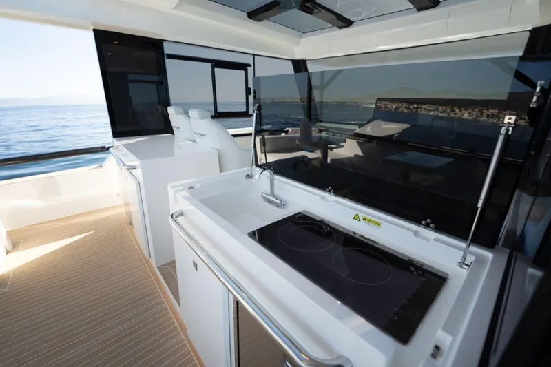  Yacht Photos Pics 2025 De Antonio Yachts D50 interior with modern kitchen and ocean view.
