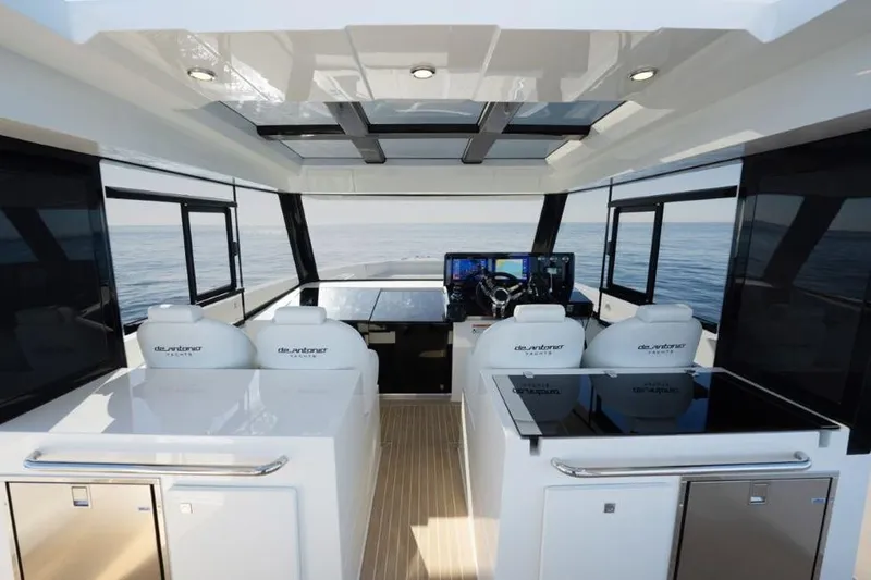  Yacht Photos Pics Interior view of 2025 De Antonio Yachts D50, featuring sleek design and modern navigation equipment.