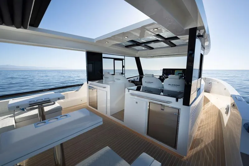  Yacht Photos Pics 2025 De Antonio Yachts D50 interior with modern design, open sea view, and luxurious seating.