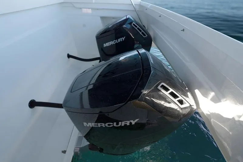  Yacht Photos Pics 2025 De Antonio Yachts D50 with dual Mercury outboard engines on calm water.