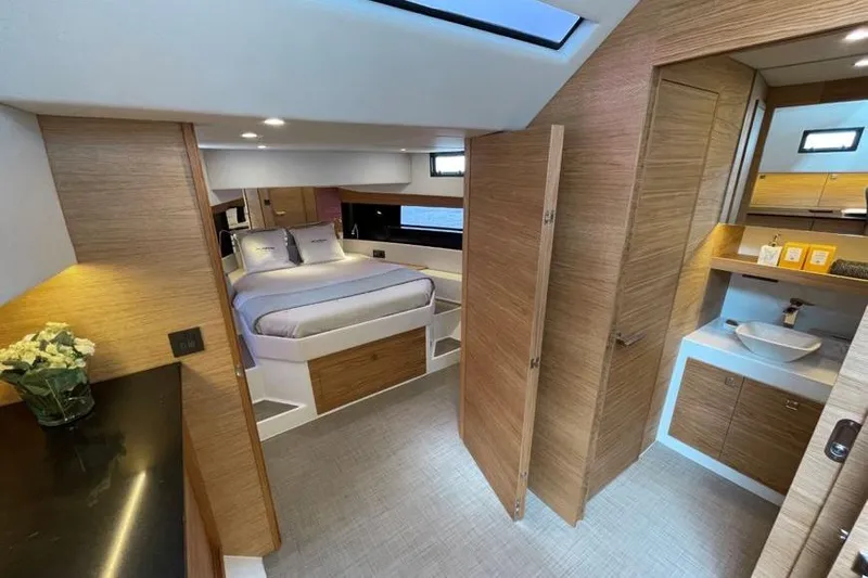  Yacht Photos Pics Luxurious interior of 2025 De Antonio Yachts D50, featuring modern bedroom and bathroom design.