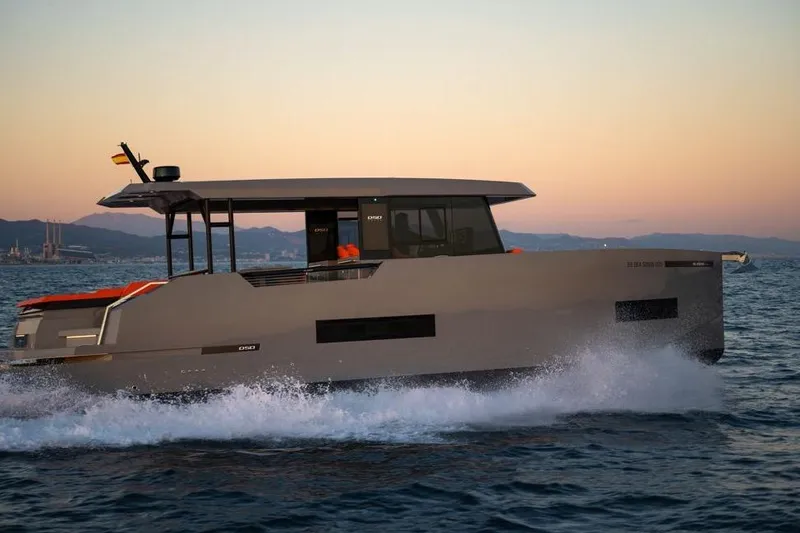  Yacht Photos Pics 2025 De Antonio Yachts D50 cruising at sunset on open water.