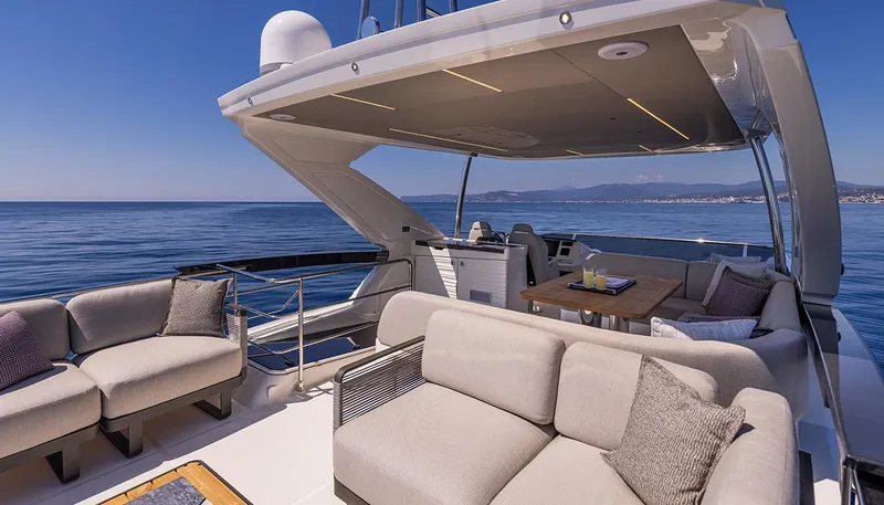  Yacht Photos Pics Luxurious 2024 Absolute 56 FLY yacht with spacious deck and elegant seating.