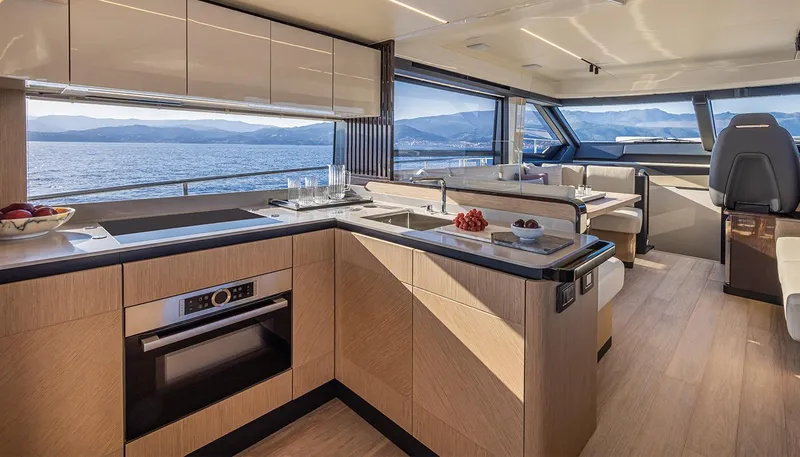  Yacht Photos Pics Luxurious interior of 2024 Absolute 56 FLY yacht with modern kitchen and scenic ocean view.